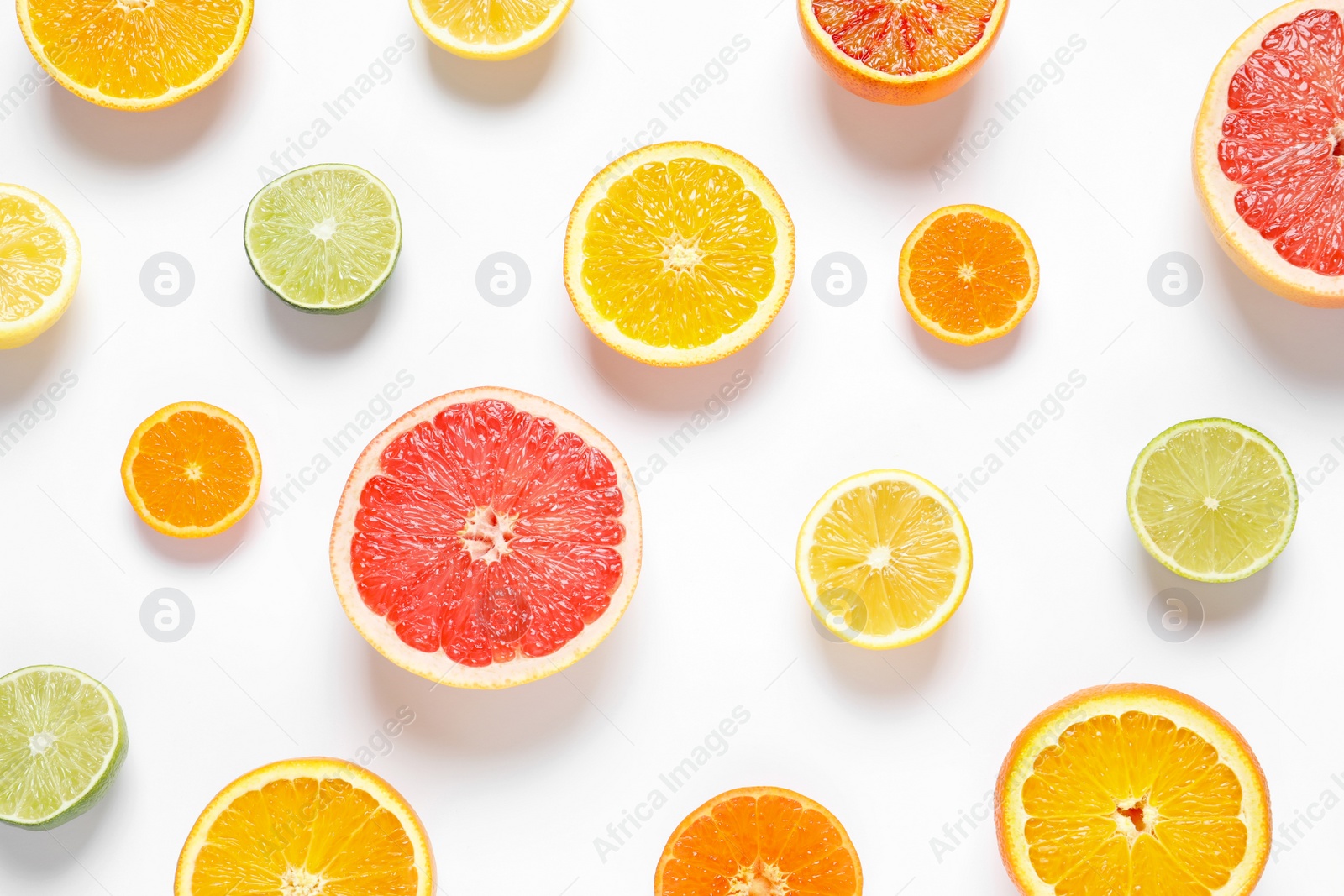 Photo of Flat lay composition with different citrus fruits on white background