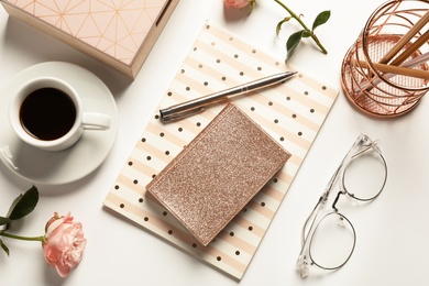 Photo of Flat lay composition with notebooks, cup of coffee and stationery on white background