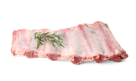 Photo of Raw ribs with rosemary on white background. Fresh meat