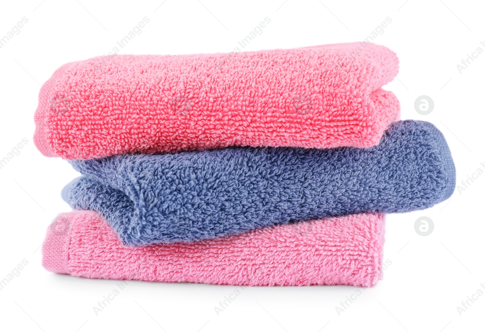 Photo of Folded soft terry towels isolated on white