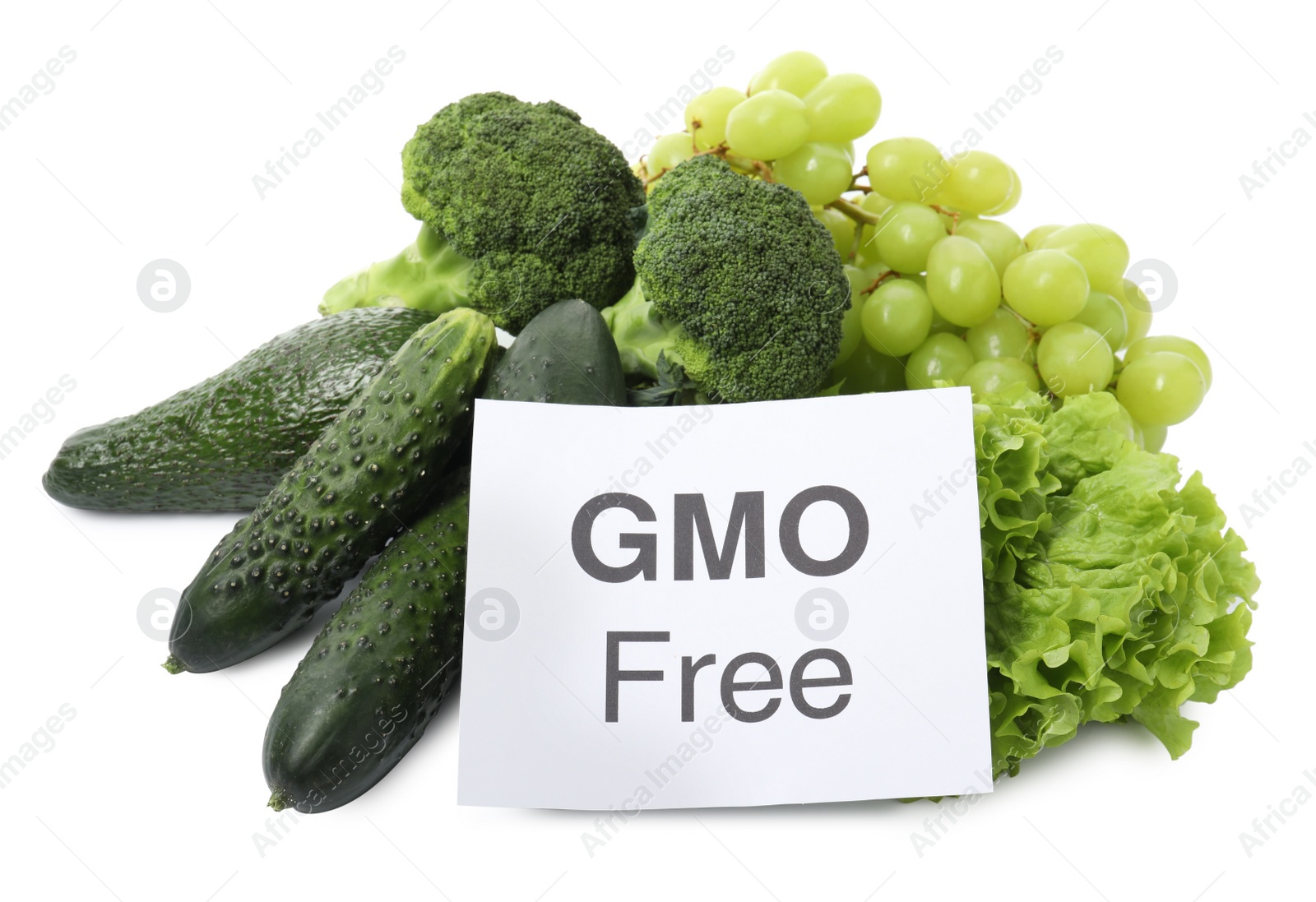 Photo of Tasty fresh GMO free products and paper card on white background