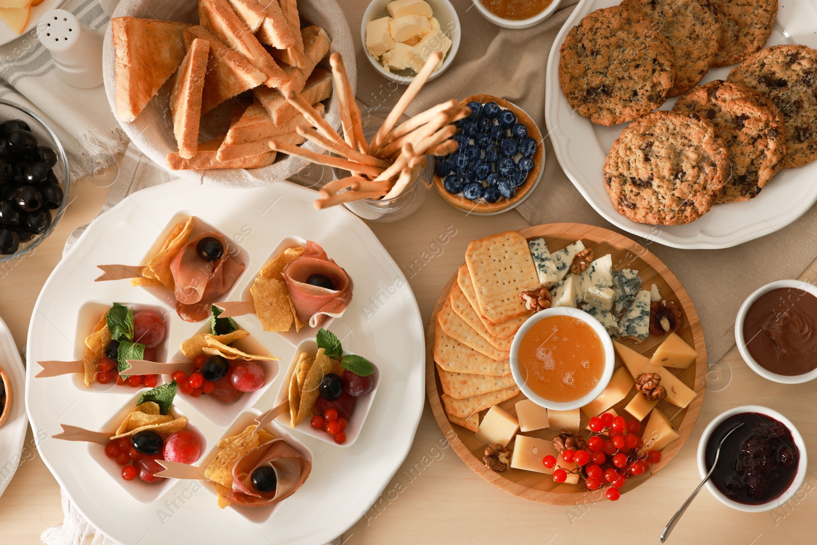 Photo of Dishes with different food on table, flat lay. Luxury brunch