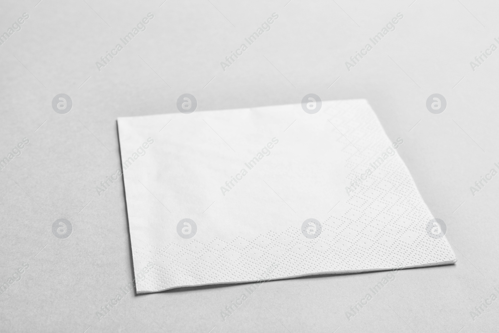 Photo of Clean napkin on grey background. Personal hygiene