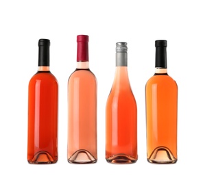 Bottles of delicious rose wine on white background. Mockup for design