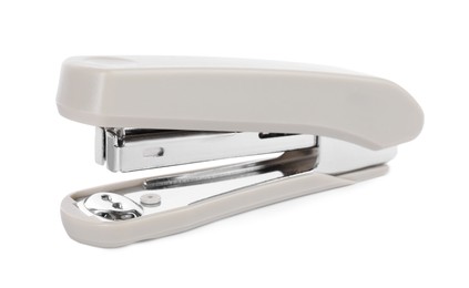 Photo of One new beige stapler isolated on white