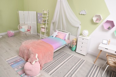 Cute child's room interior with toys and modern furniture