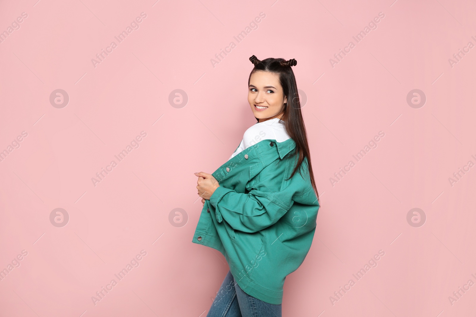 Photo of Portrait of beautiful young woman in stylish clothes on color background