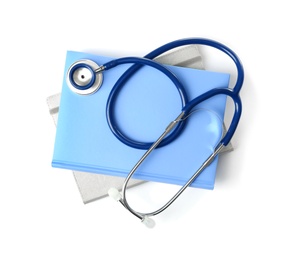 Student textbooks and stethoscope on white background, top view. Medical education