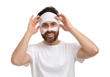 Photo of Man with headband washing his face on white background