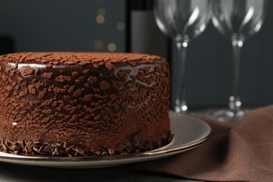 Photo of Delicious chocolate truffle cake on table, closeup