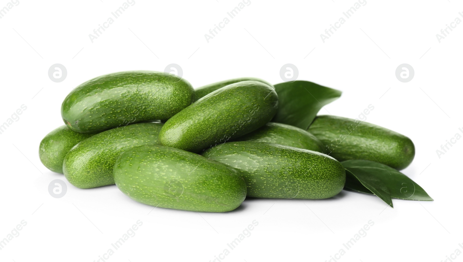 Photo of Fresh whole seedless avocados with leaves isolated on white