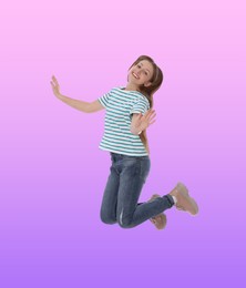 Happy cute girl jumping on color gradient background