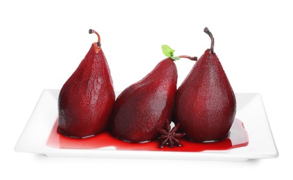 Photo of Tasty red wine poached pears with mint and anise isolated on white