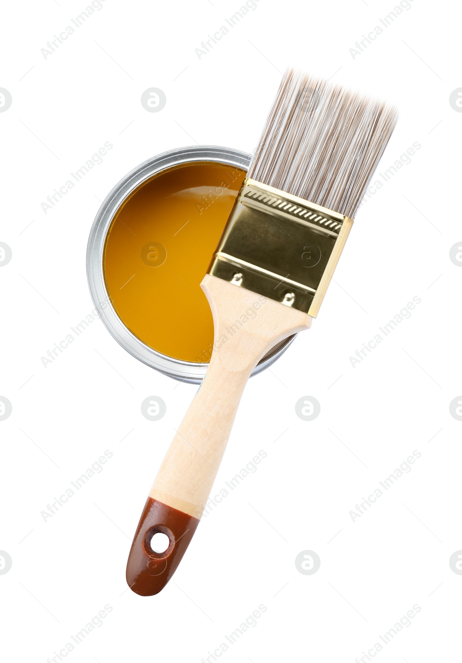 Photo of Can of yellow paint with brush isolated on white, top view