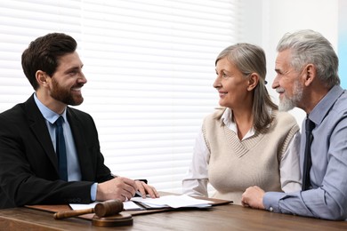 Senior couple having meeting with lawyer in office