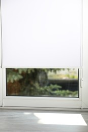 Photo of Empty wooden window sill and spruce tree outside