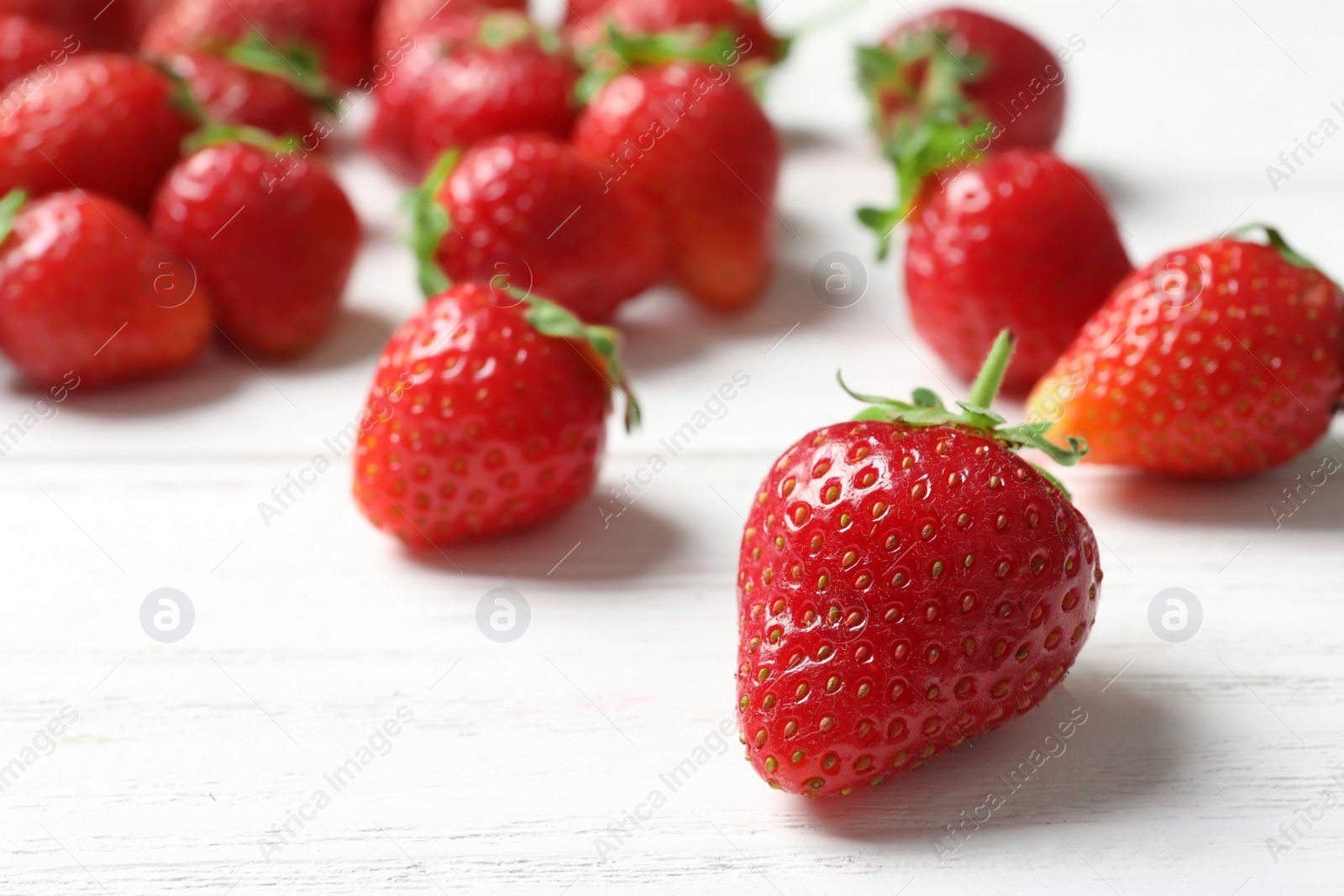 Photo of Ripe red strawberries on light background, closeup