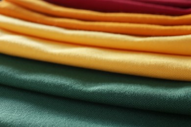 Photo of Different colorful kitchen napkins as background, closeup
