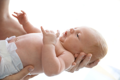 Father holding his cute newborn baby, closeup