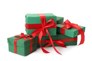 Photo of Green gift boxes with red bows on white background