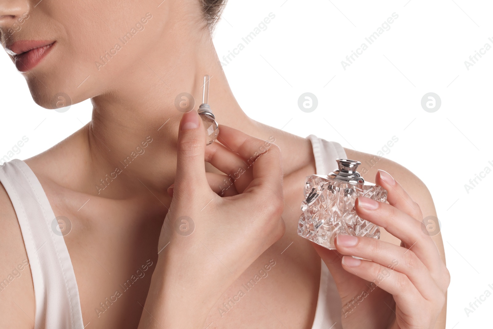 Photo of Young woman applying perfume on white background, closeup