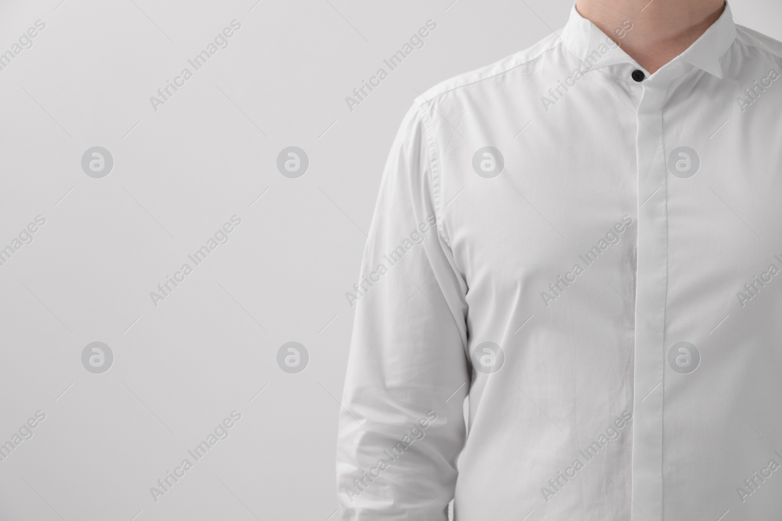 Photo of Man wearing classic shirt on white background, closeup