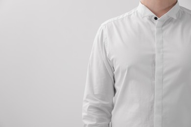 Photo of Man wearing classic shirt on white background, closeup