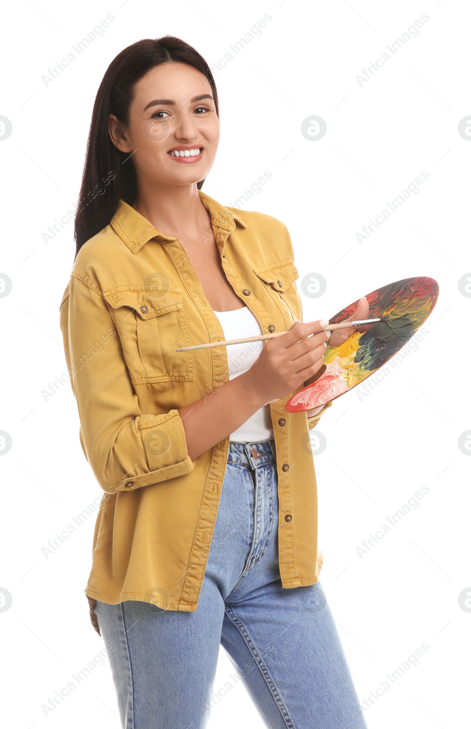 Photo of Young woman drawing with brush on white background