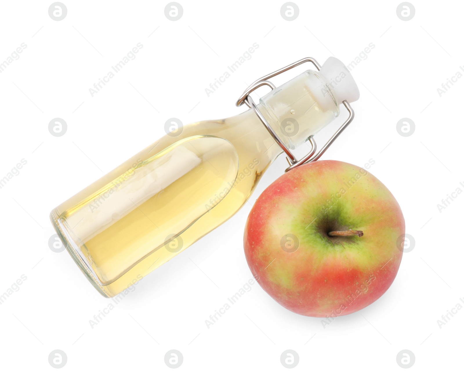 Photo of Apple vinegar in bottle and fruit isolated on white, top view