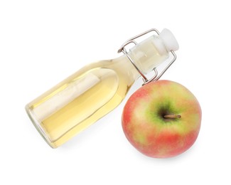 Apple vinegar in bottle and fruit isolated on white, top view