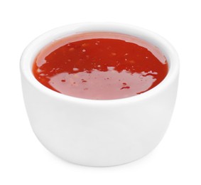 Photo of Spicy chili sauce in bowl isolated on white