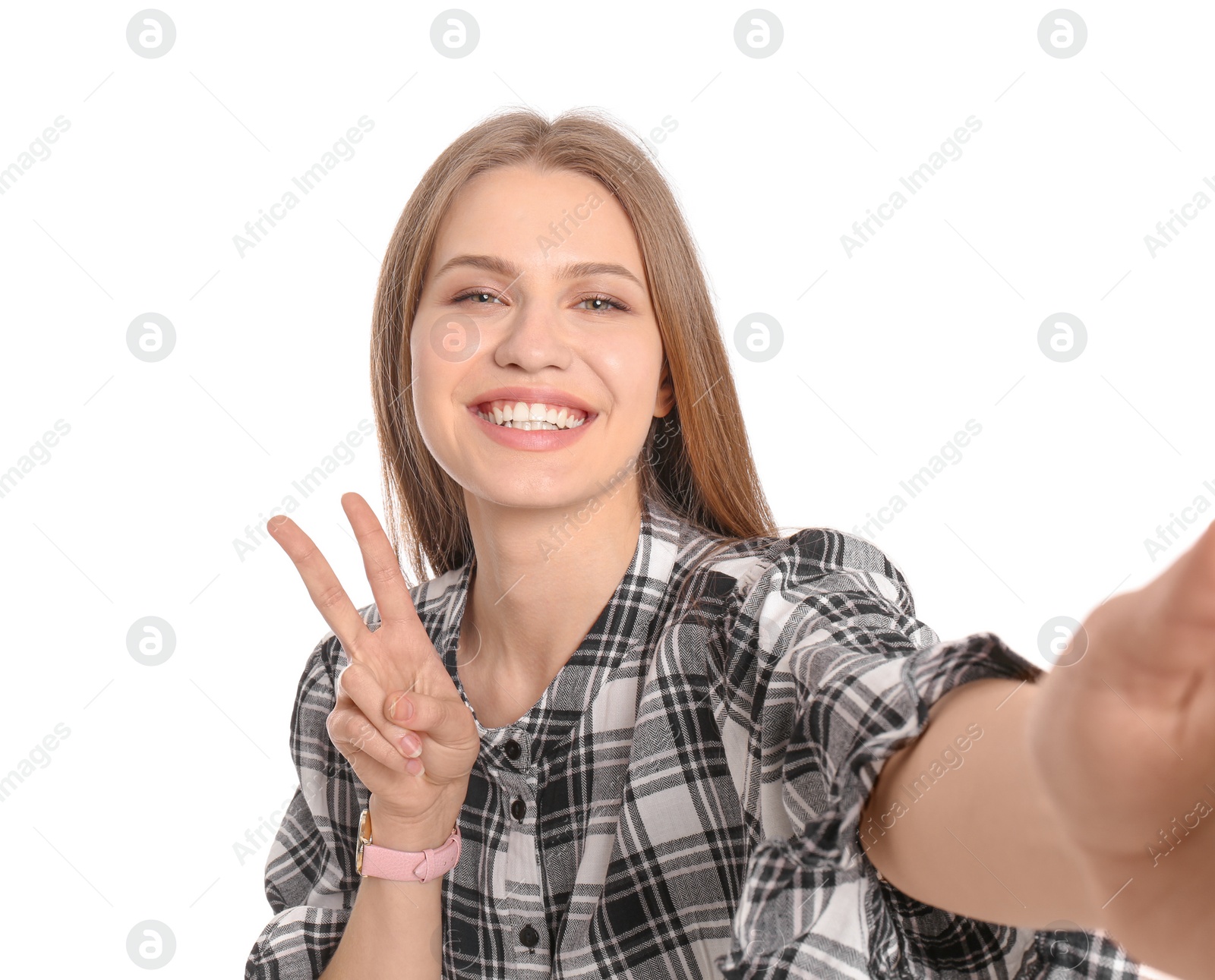 Photo of Young beautiful woman taking selfie against white background