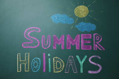 Text Summer Holidays written on school chalkboard