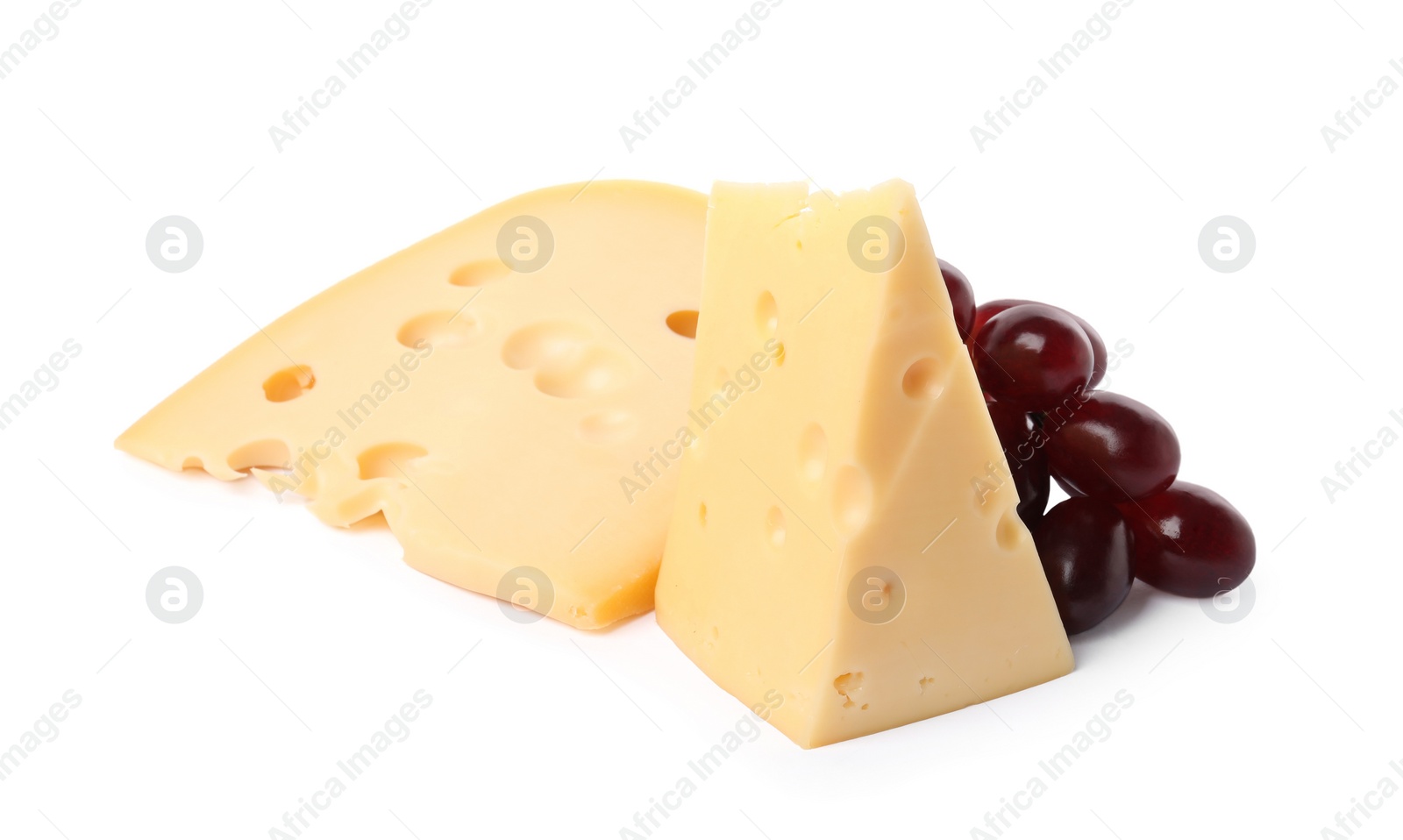 Photo of Pieces of delicious cheese and grapes isolated on white