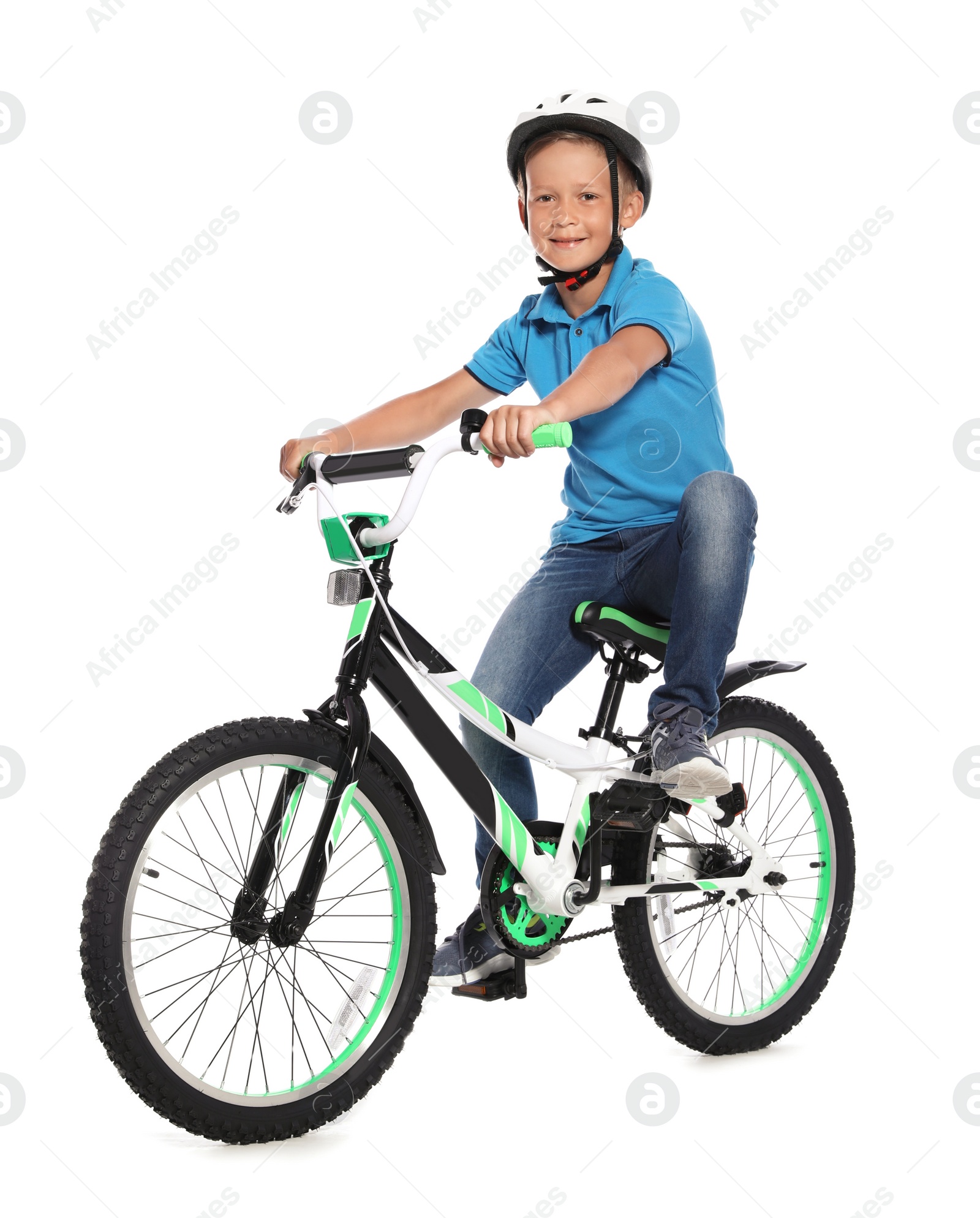 Photo of Portrait of cute little boy with bicycle on white background