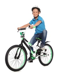 Portrait of cute little boy with bicycle on white background