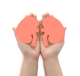 Photo of Woman holding paper cutout of kidneys on white background, top view