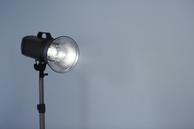 Studio lighting against gray background. Professional photo equipment