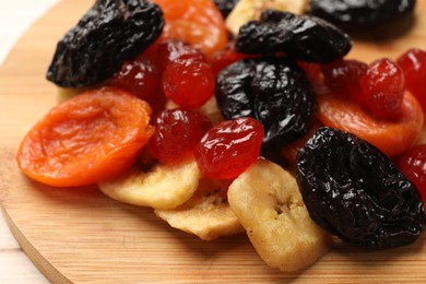 Photo of Mix of delicious dried fruits on table, closeup