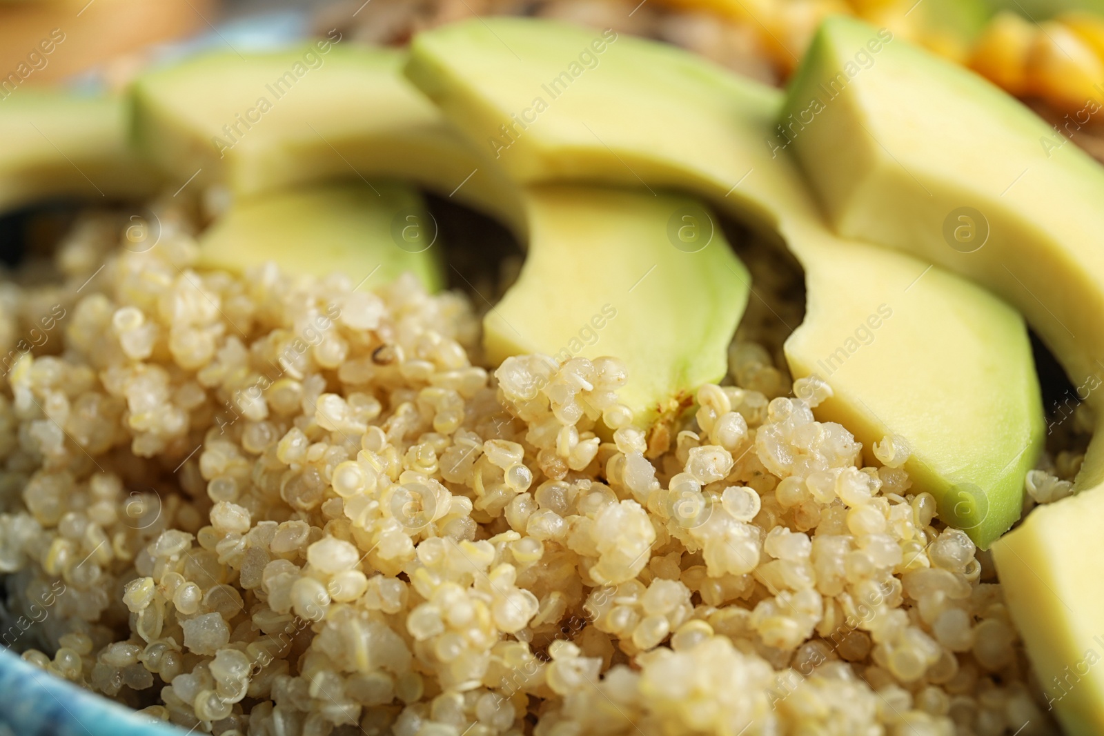 Photo of Closeup view of cooked quinoa and fresh avocado