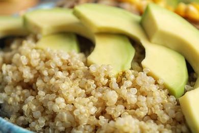 Closeup view of cooked quinoa and fresh avocado