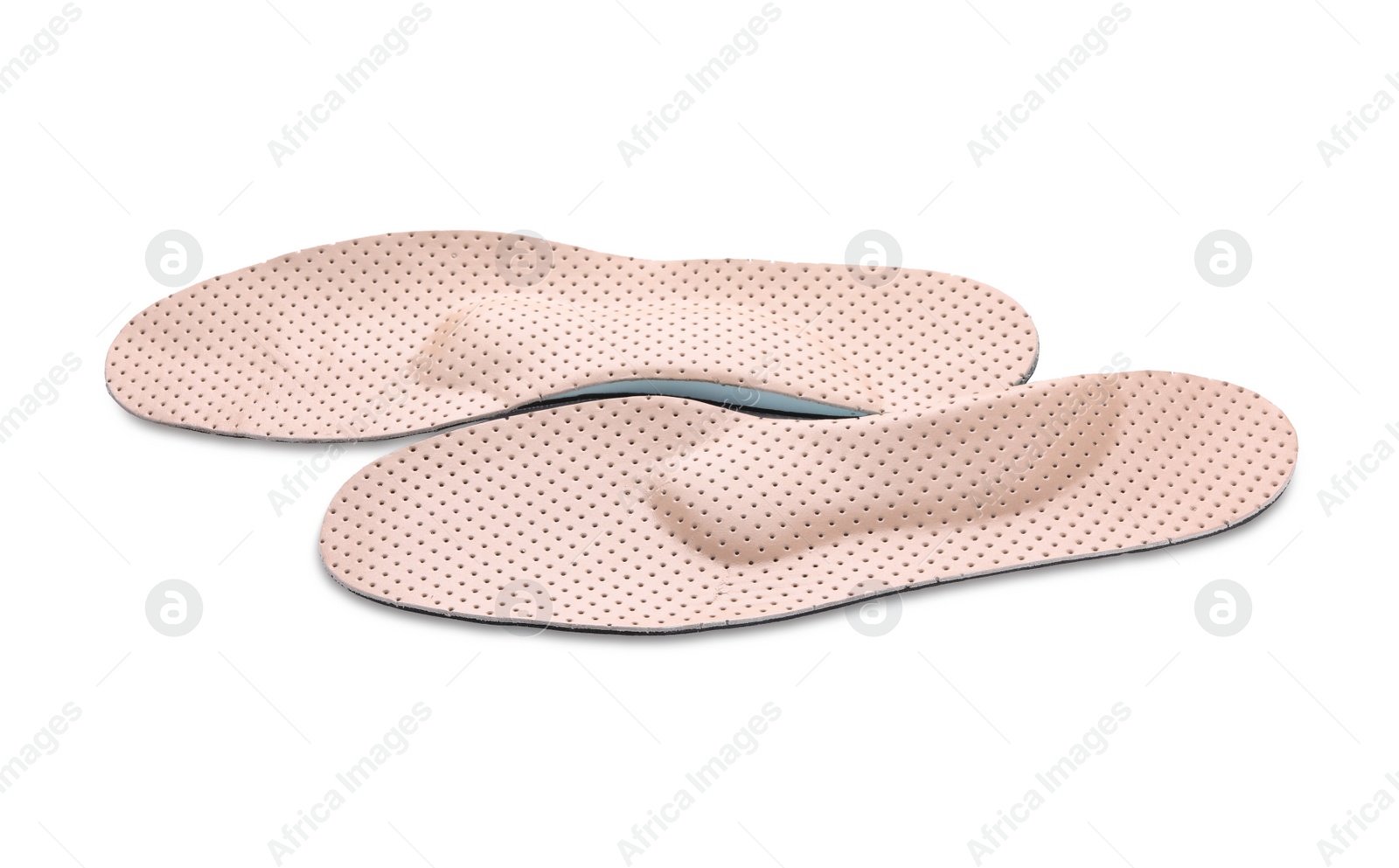 Photo of Beige comfortable orthopedic insoles isolated on white