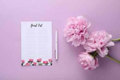 Guest list, pen and beautiful flowers on violet background, flat lay. Space for text