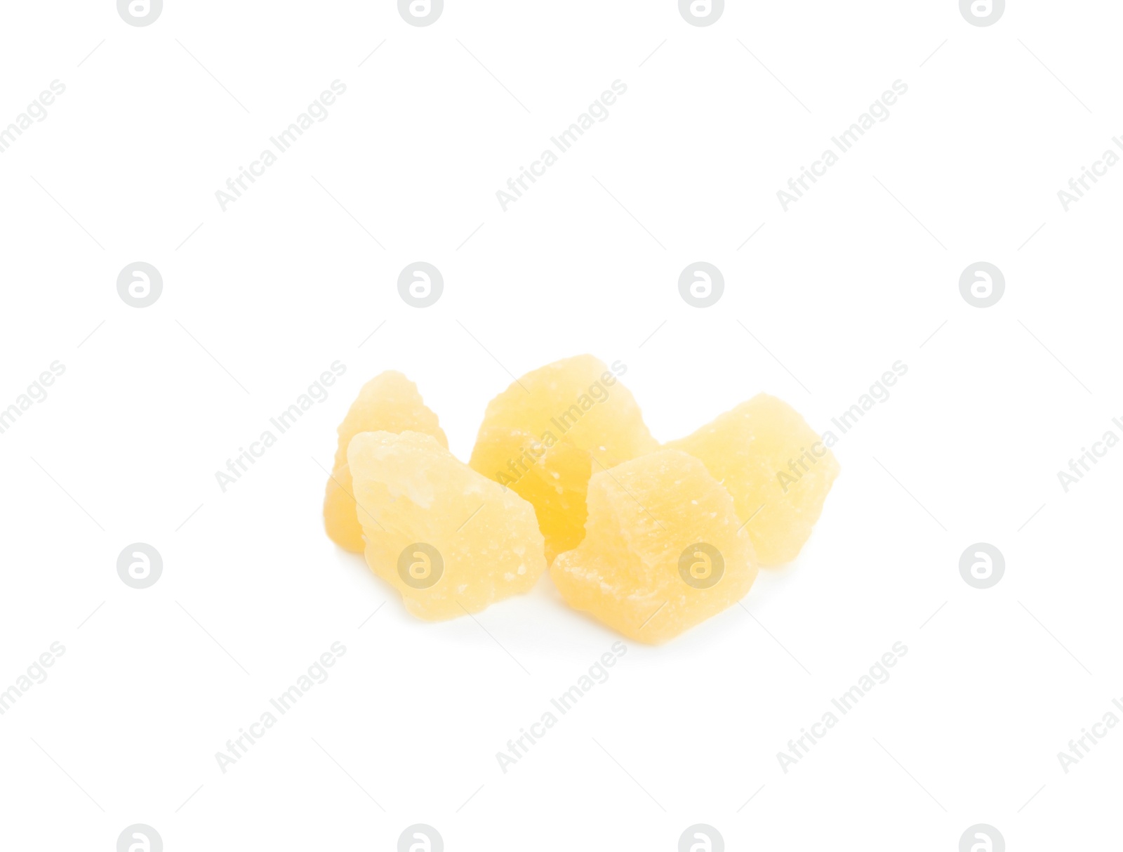 Photo of Delicious yellow candied fruit pieces on white background