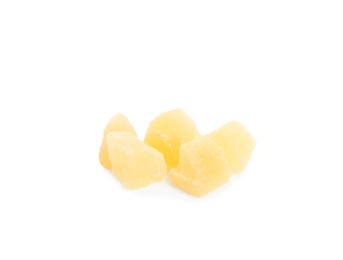 Delicious yellow candied fruit pieces on white background