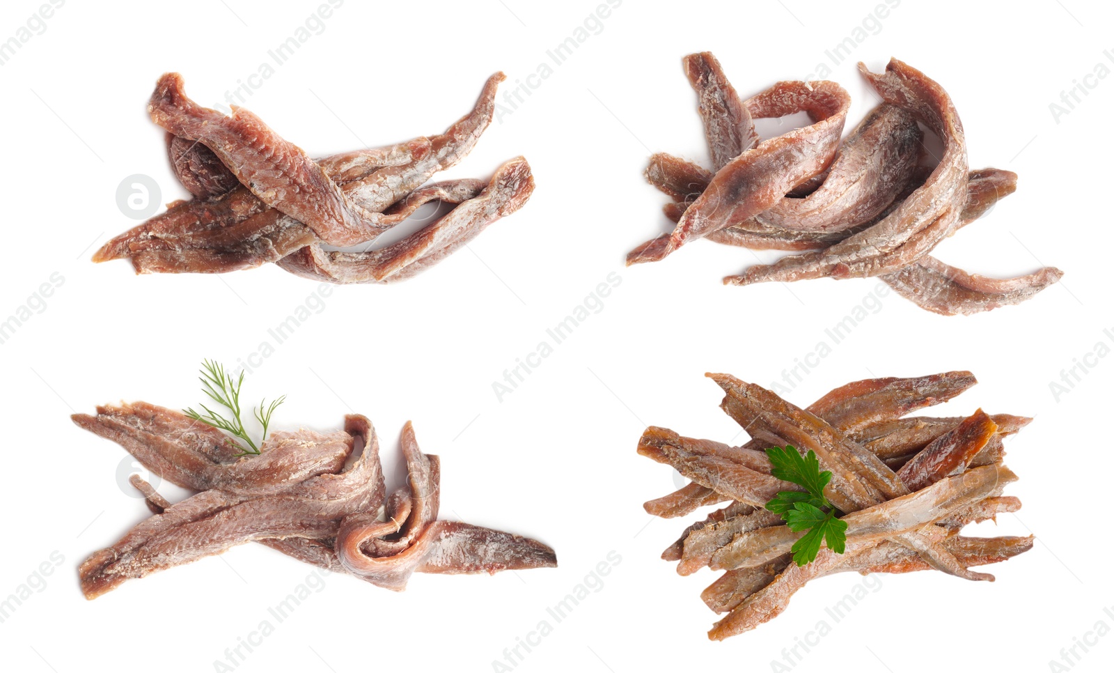 Image of Set with delicious anchovy fillets on white background, top view