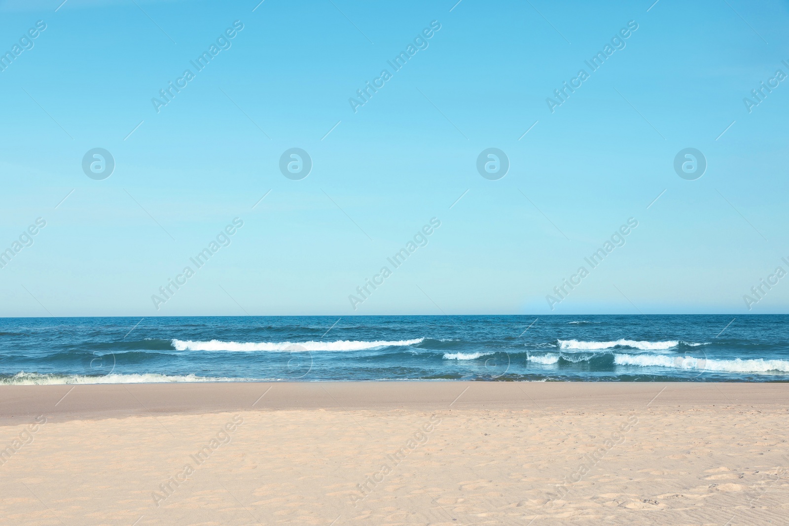 Photo of Picturesque view of beautiful sea and sandy beach on sunny day