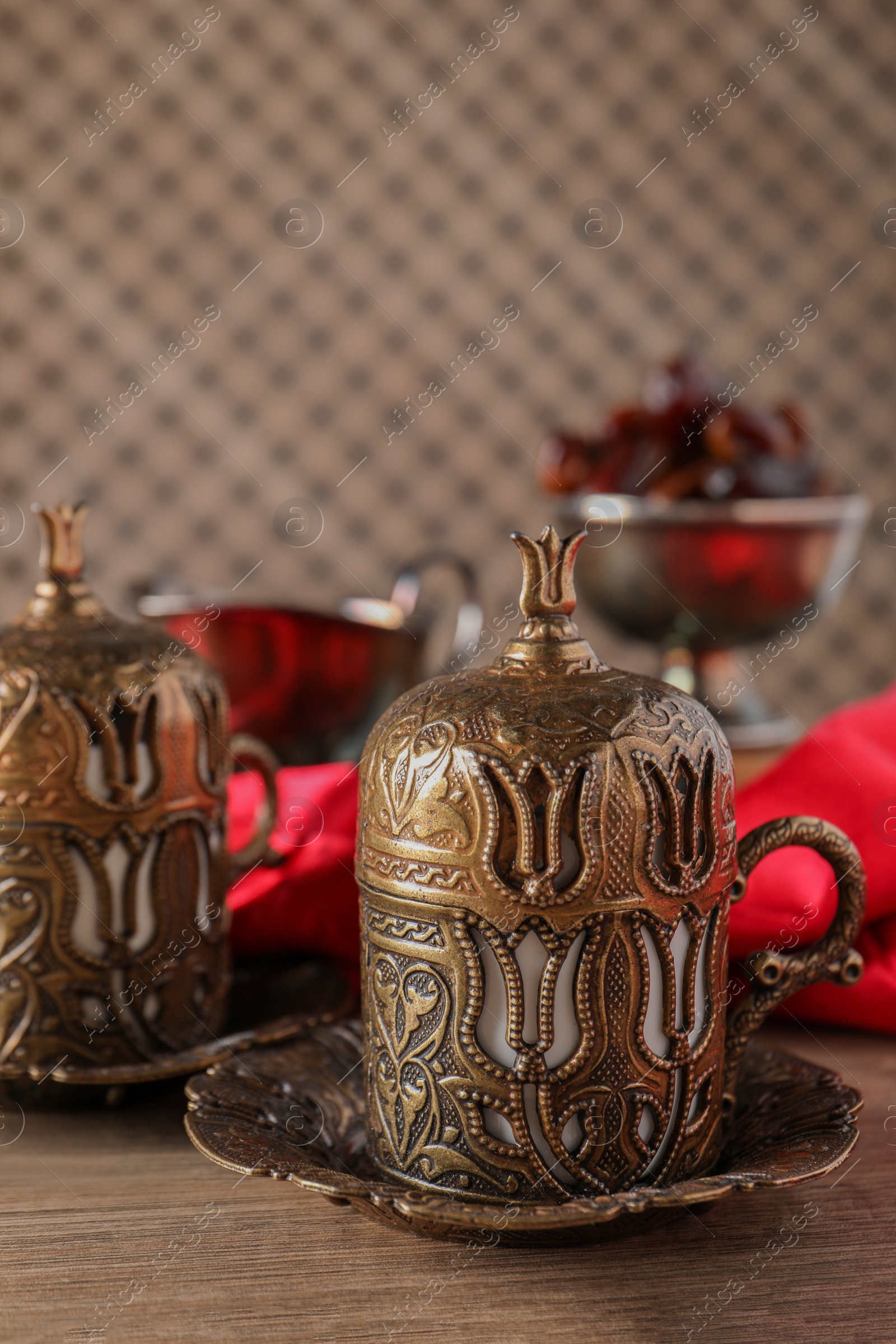 Photo of Beautiful vintage cup holders on wooden table