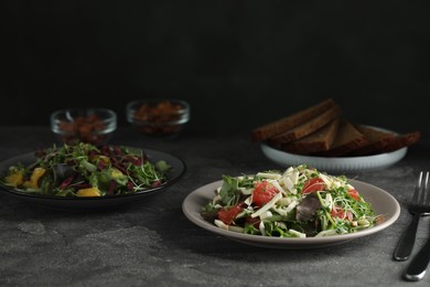 Photo of Delicious carrot salad served on grey table