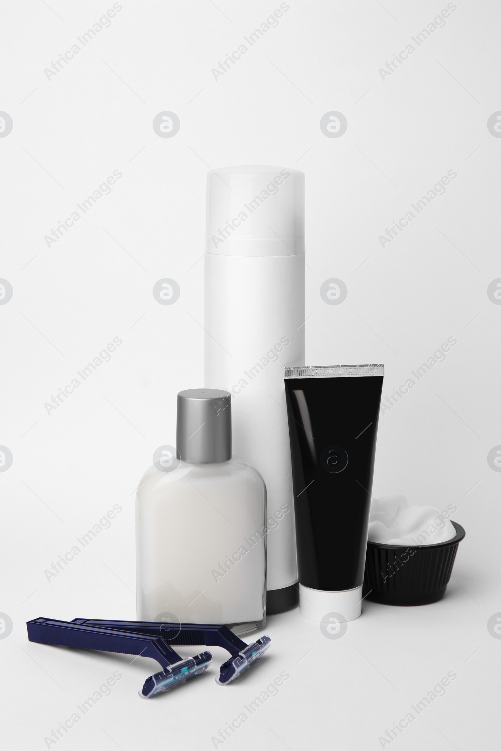 Photo of Different men's shaving accessories on light background